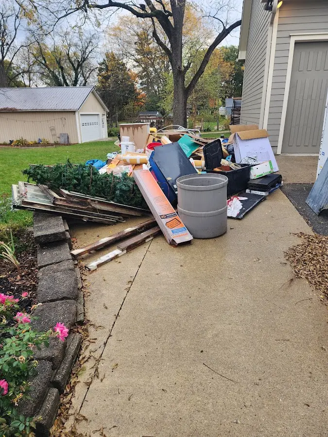 Dumpster being loaded with debris for Roofing Dumpster Rental in Johnson Lane